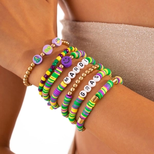 Stackable Mardi Gras beaded bracelet set with purple and gold Heishi clay discs and letters