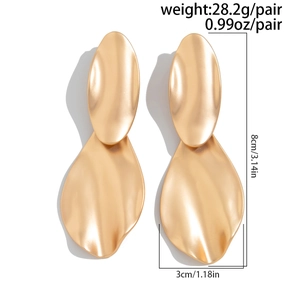 Detail view of large gold irregular geometric earrings with size and weight measurements