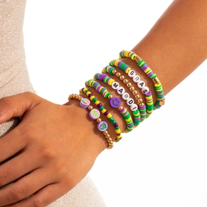 Detail of 8-piece Mardi Gras beaded bracelet set with letter beads and clay discs