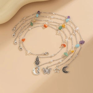 Detail view of 5-piece bohemian turquoise and pearl hair clips set with charms