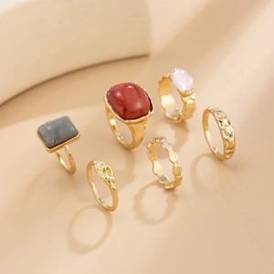 Detailed set of 6 vintage gold alloy rings featuring red and pink acrylic gemstones