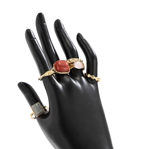 Detailed set of five vintage gold-tone rings featuring colorful acrylic stone inlays