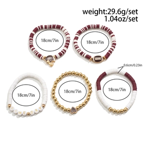 Detail of five-piece polymer clay beaded bracelets with football charms and GAME DAY text