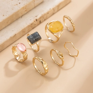 7-piece gold alloy ring set with colorful resin stones in a bohemian luxury style