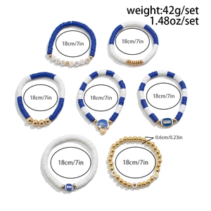 Detailed view of 7-piece sporty gameday bracelets with blue and white heishi beads