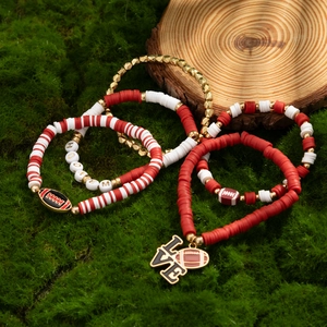 Detail view of five-piece sports-themed beaded bracelet set with rugby and letter charms