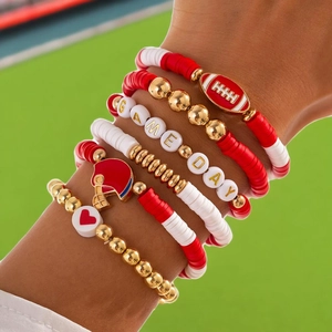 Detail of multi-layer beaded bracelet set with GAME DAY text and football charms