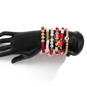 Detail of 5-piece stretch bracelet set with GAME DAY beads and football themed charms