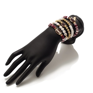 Detail of multi-layer beaded bracelet set with GAME letter beads and golden rugby charm