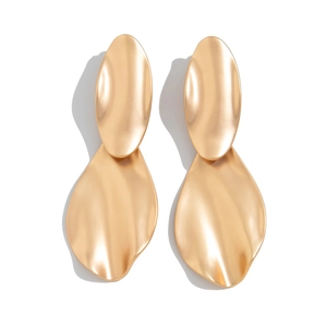 Detailed view of matte gold irregular wave drop earrings with textured leaf shape