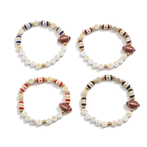 Detail view of American football themed beaded bracelets with acrylic letters and heart beads