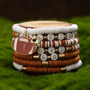 Detail of multi-layer Super Bowl football bracelet set with letter beads and turkey charm