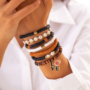 Detail of Gameday beaded bracelet set with rugby ball pendant and colorful heishi beads