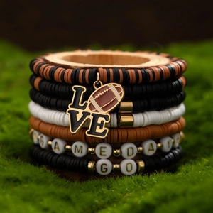 Detail shot of multi-layer beaded bracelets with LOVE charm and football pattern