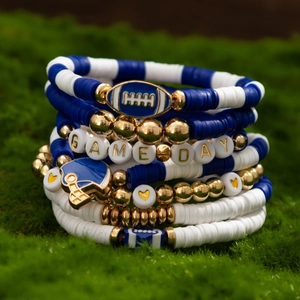 Detail of stacked bohemian bracelets with GAME DAY letter beads and football charms