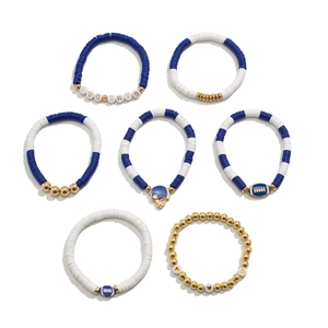 Detail view of 7pcs blue and gold clay bead bracelets with GAMEDAY and football charms