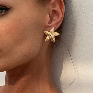 Exaggerated gold starfish stud earrings with pearls for ocean beach party style