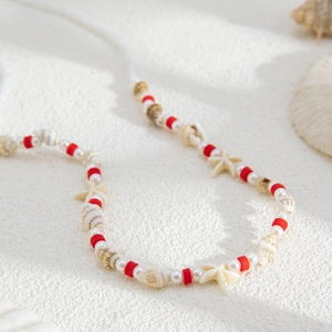 Chaîne de corps bikini avec perles, perles rouges, coquillages et étoiles de mer