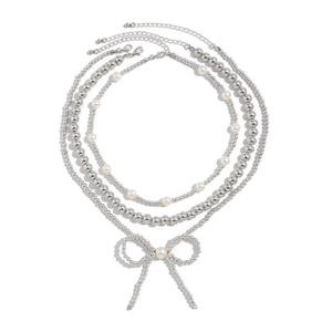 Three-layer bohemian beaded necklace set with a metallic bow pendant and pearls
