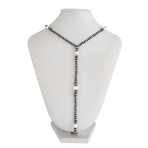 Detailed view of vintage Y-shaped lariat necklace with grey beads and white pearls