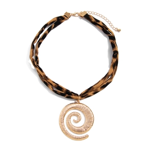 Detail of bohemian leopard print fabric necklace with large golden spiral metal pendant