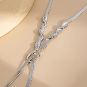 Detailed close-up of a silver Y-shaped snake chain necklace with twisted weave texture