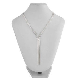 Close-up of silver Y-shaped snake bone chain necklace with elegant metallic fringe detail