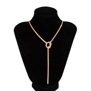 Detail of a minimalist gold Y-shaped lariat necklace with a sleek snake chain design
