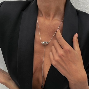 Modern silver Y-necklace with irregular bean slider and teardrop pendant on snake chain