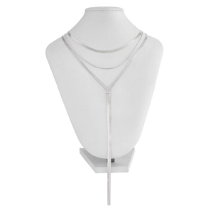 Detail of silver layered necklace showing flat snake chains and Y-shaped pendant on mannequin
