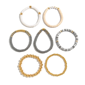 7-piece Bohemian stretch bracelet set with wooden beads, MAMA letter charms and gold accents
