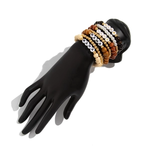 Detail of bohemian multilayer bracelet set with wood beads and MAMA letter charms