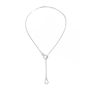 Close-up of minimalist silver snake chain necklace with Y-shaped teardrop pendant