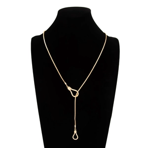 Detail of gold Y-shaped lariat necklace with interlocking U-rings on black neck bust
