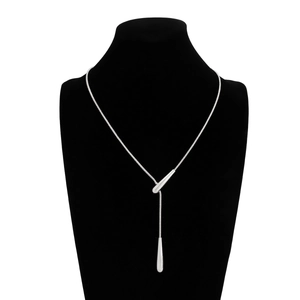 Detailed view of silver snake chain necklace with lariat teardrop pendants on mannequin