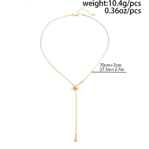 Detail of gold Y-shaped necklace showing twisted metal accents and size specifications