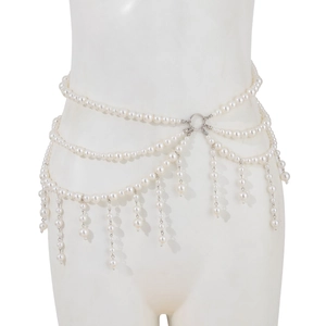 Detail of layered imitation pearl body chain with silver ring and elegant tassel drops