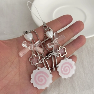 Cute phone charm with white heart bead, pink ribbon, and narutomaki fish cake pendant