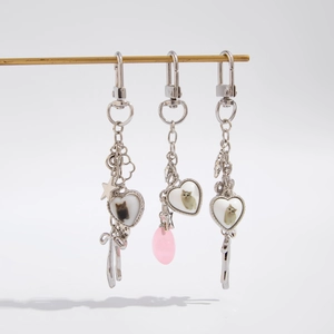 Set of silver alloy heart cat photo keychains with butterfly and flower pendants