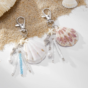 Detail of seashell and starfish pendants with pearls and beads for bags and keychains