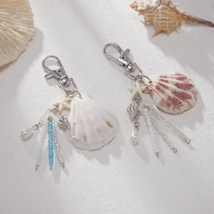 Detailed macro view of ocean shell keychain with sea star and pearl beaded tassels