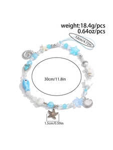 Detail showing blue ocean theme phone strap with starfish and shell charms weighing 18.4g