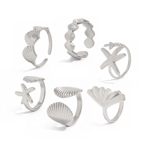 Detailed set of six silver ocean-themed rings featuring starfish and seashell designs