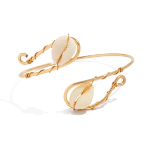 Bohemian gold wire wrapped upper arm band with natural sea shells on white background