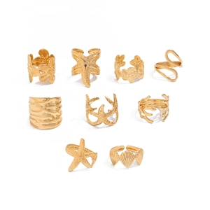 Detailed view of a 9-piece gold ocean ring set featuring starfish and shell motifs
