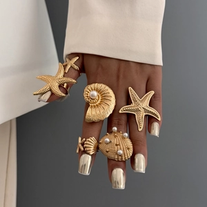 6-piece gold starfish and seashell stacking ring set with elegant white pearls for women