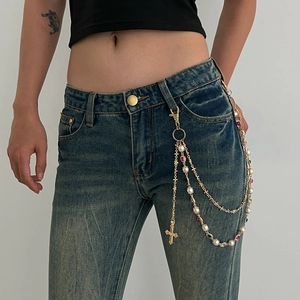 Punk hip-hop waist chain with colorful pearls and cross pendant on denim jeans