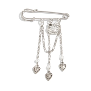 Retro silver pin brooch with heart pendants, pearls and tassel chains on white background