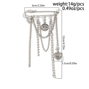 Detail view of silver heart pendant pin with multi-layer tassel chains and coin charms