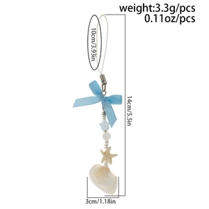 Detail of ocean-style charm with starfish, seashell pendants and blue bow, size 14cm